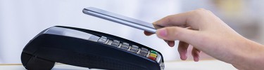 Person paying with mobile wallet